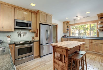 Modern kitchen with hardwood floors and kitchen island